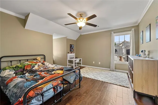 a bed room with a bed and a chandelier