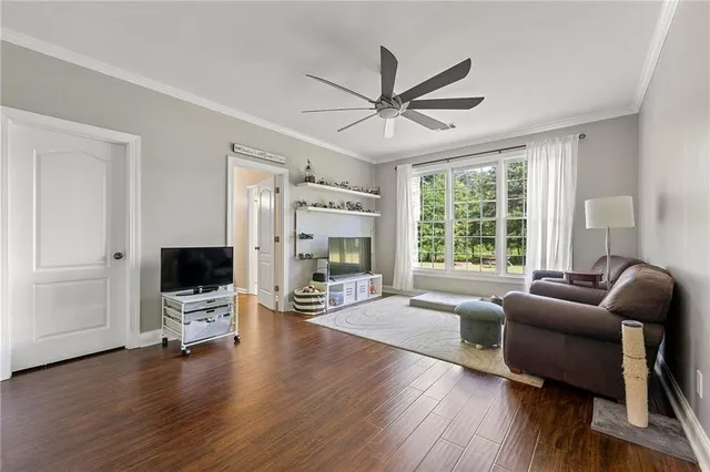a living room with fireplace furniture and a flat screen tv