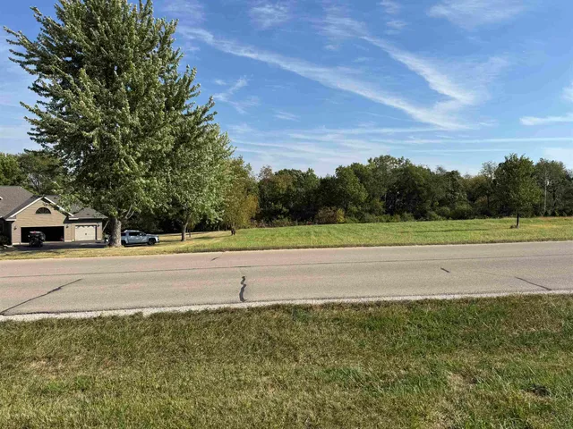 a view of a town with large trees