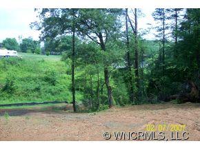 240 Gouges Branch Road Leicester, NC 28748 - Photo 5 of 18 a view of outdoor space with trees all around
