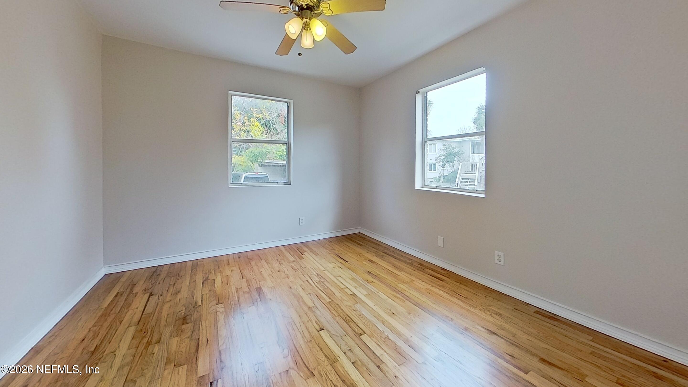 3005 Walton Street, Unit 2 Jacksonville, FL 32207 - Photo 11 of 13 wooden floor in an empty room with a window