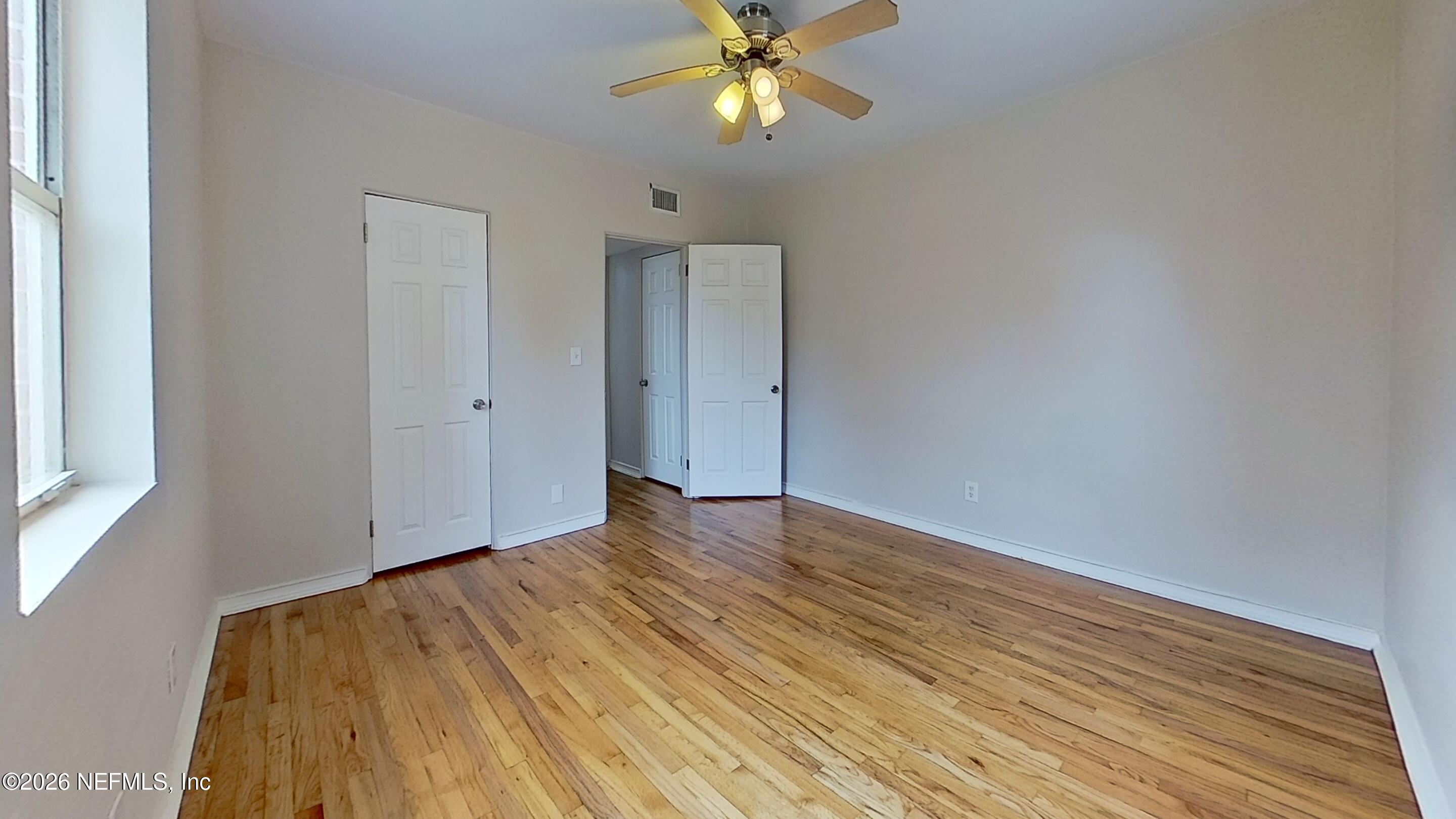 3005 Walton Street, Unit 2 Jacksonville, FL 32207 - Photo 10 of 13 a view of empty room with wooden floor and fan