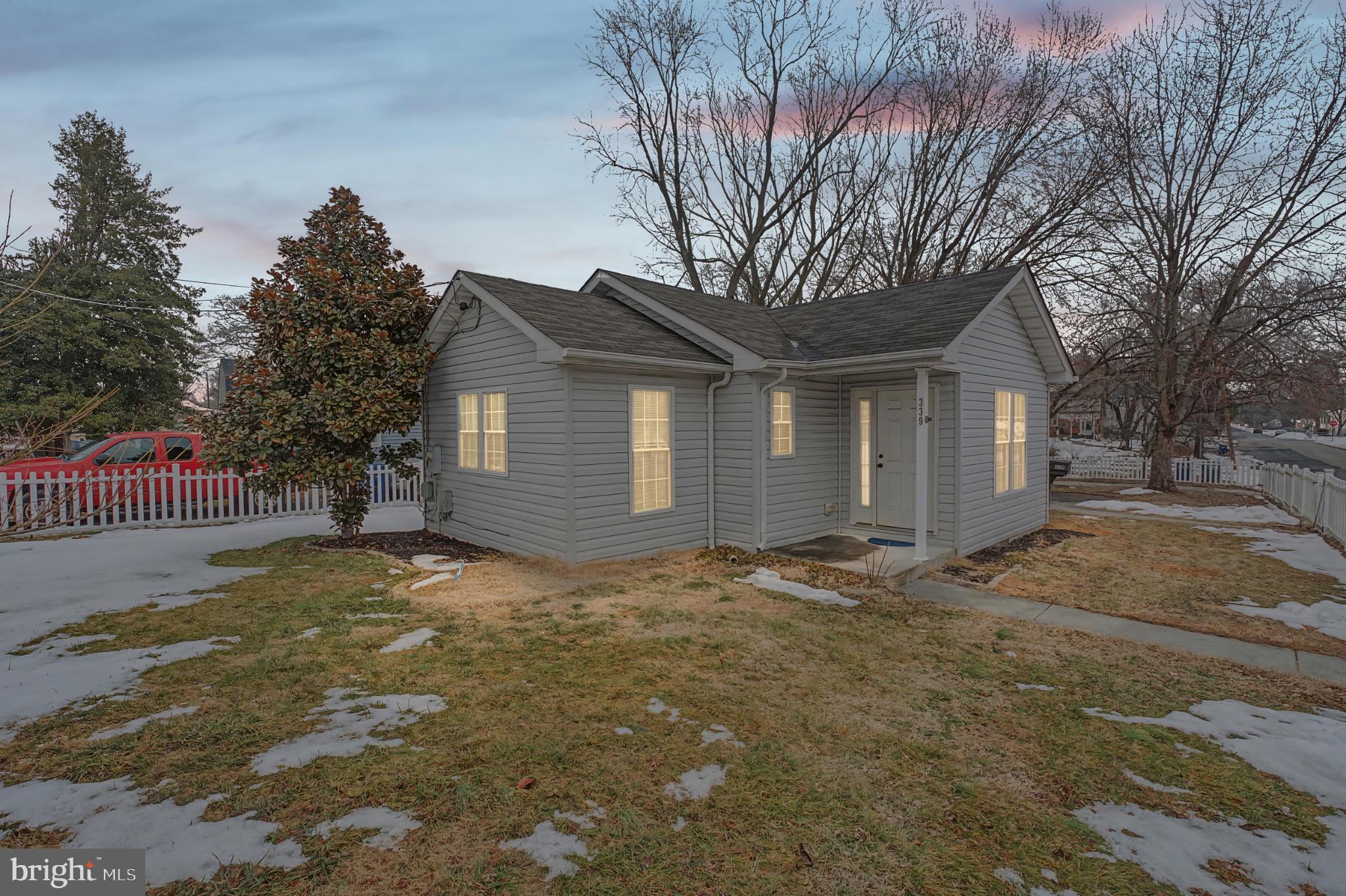 Charming gray cottage at twilight glow.