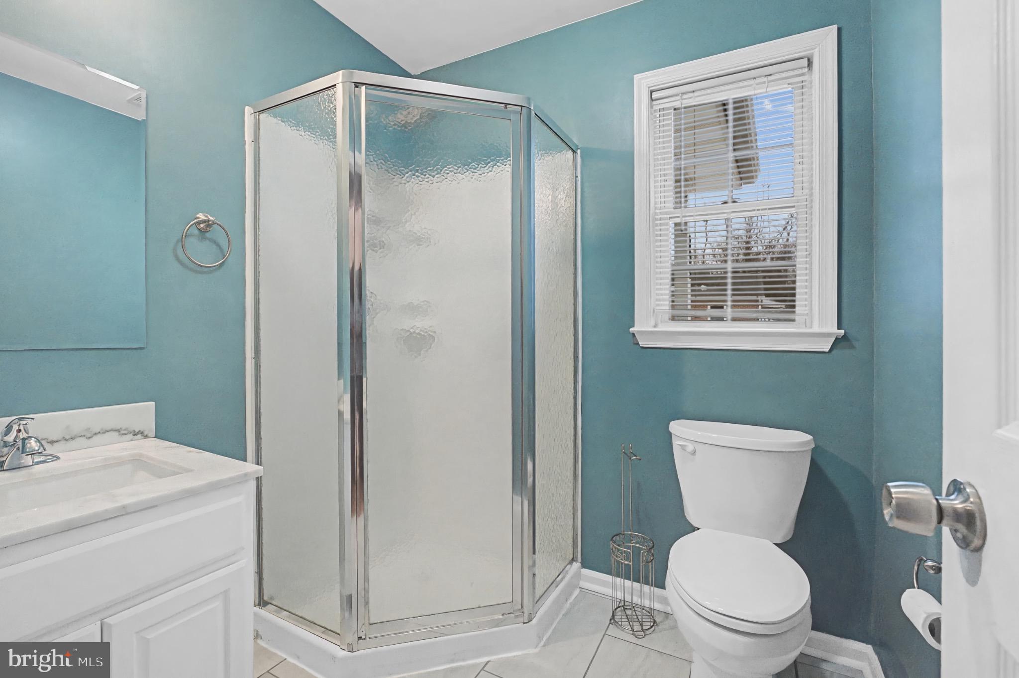 339 Edmund Street Aberdeen, MD 21001 - Photo 17 of 30 Modern bathroom with vibrant teal walls.