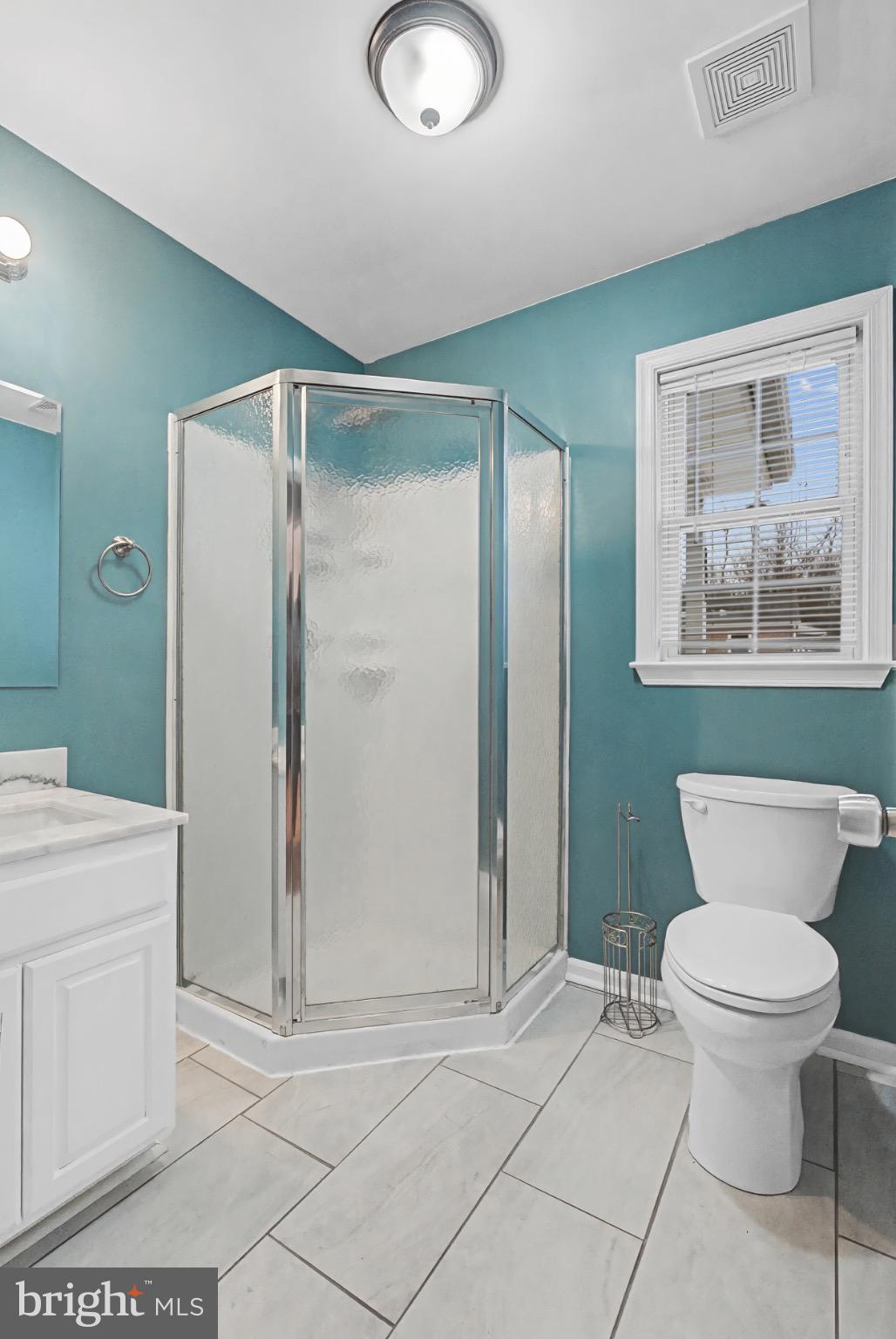 339 Edmund Street Aberdeen, MD 21001 - Photo 29 of 30 Modern bathroom with vibrant teal walls.