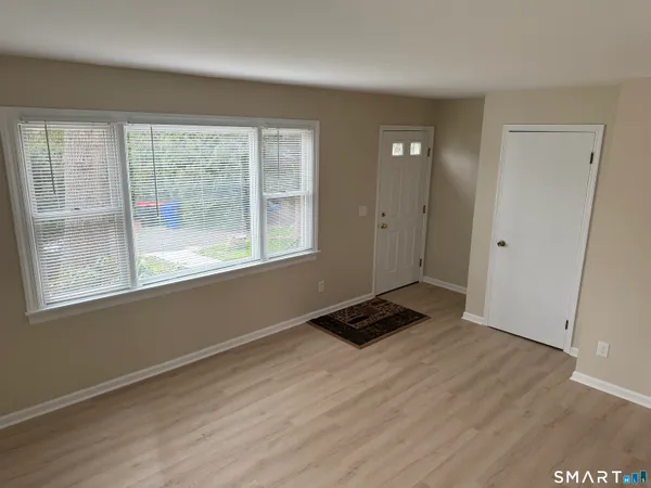 a room with window and a wooden floor