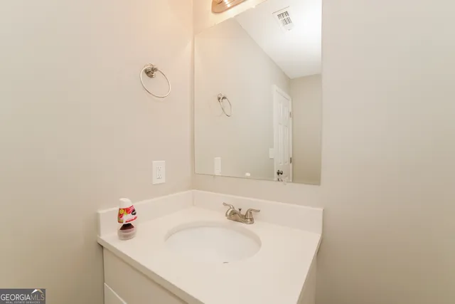 a white toilet sitting next to a bath tub