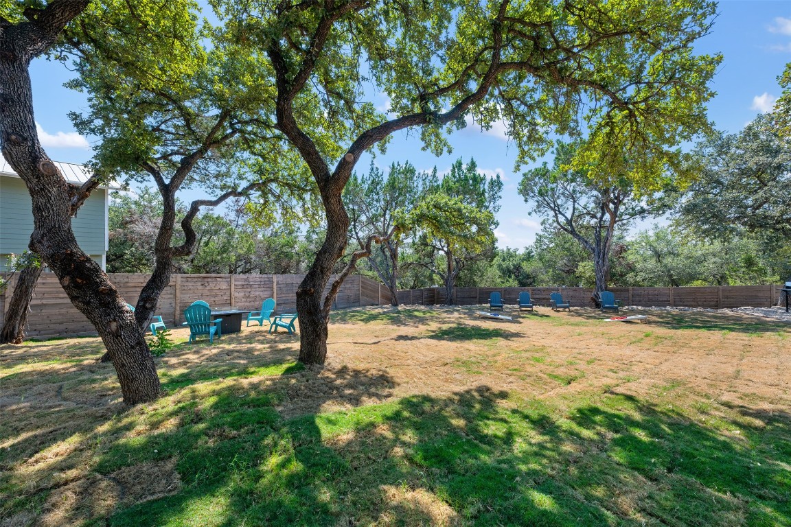1301 Scenic Circle Spicewood, TX 78669 - Photo 19 of 39 a view of a yard with swimming pool