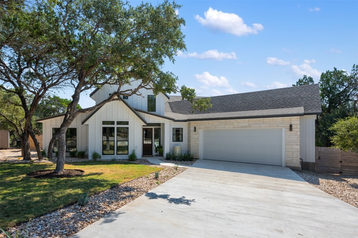 1301 Scenic Circle Spicewood, TX 78669 - Photo 2 of 39 a front view of a house with a yard