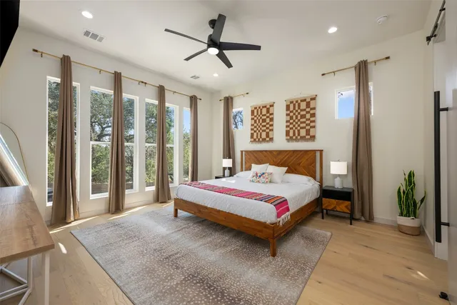 a spacious bathroom with a double vanity sink mirror and bathtub