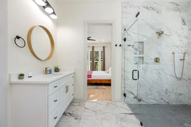 a bathroom with a bathtub and shower