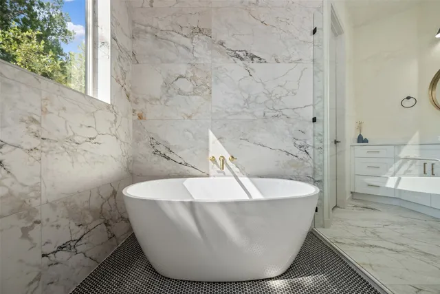 a en suite bathroom with a sink and a mirror