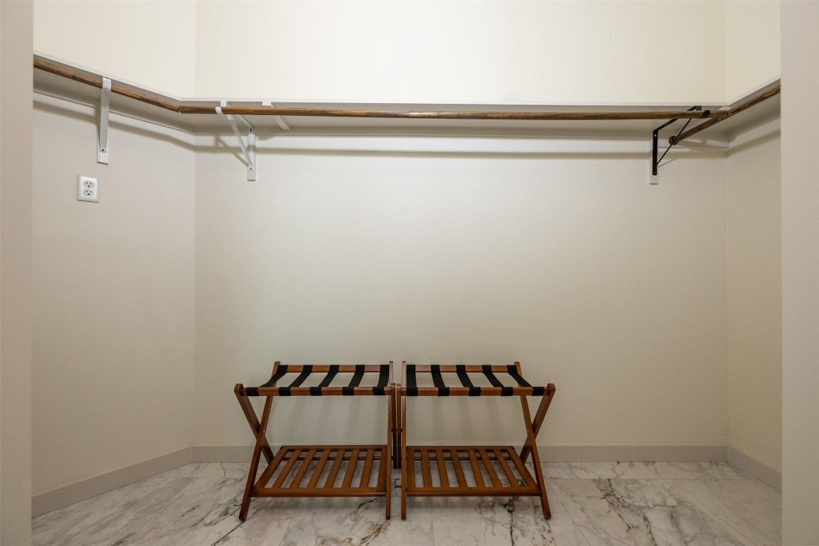 1301 Scenic Circle Spicewood, TX 78669 - Photo 29 of 39 a view of a room with racks on the wall