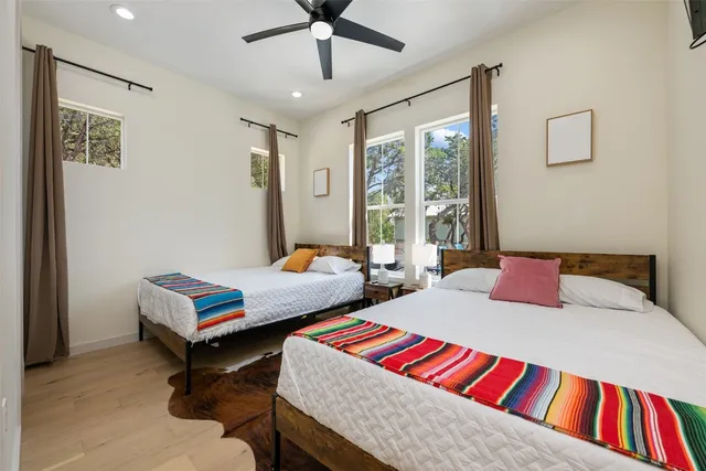 a bathroom with a double vanity sink mirror and shower
