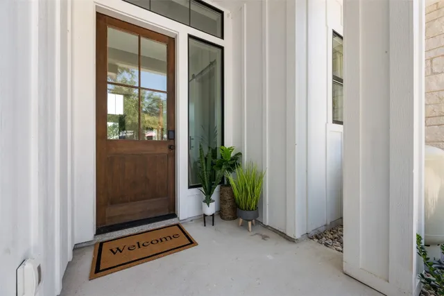 a view of an entryway with wooden floor and a potted plant
