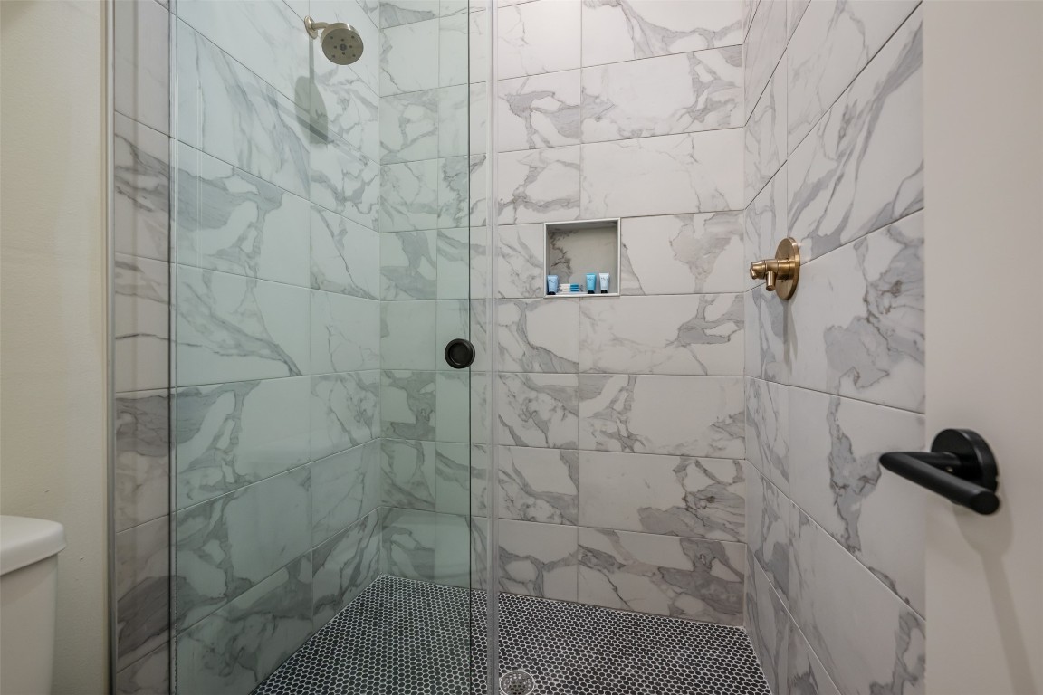 1301 Scenic Circle Spicewood, TX 78669 - Photo 31 of 39 a bathroom with a shower