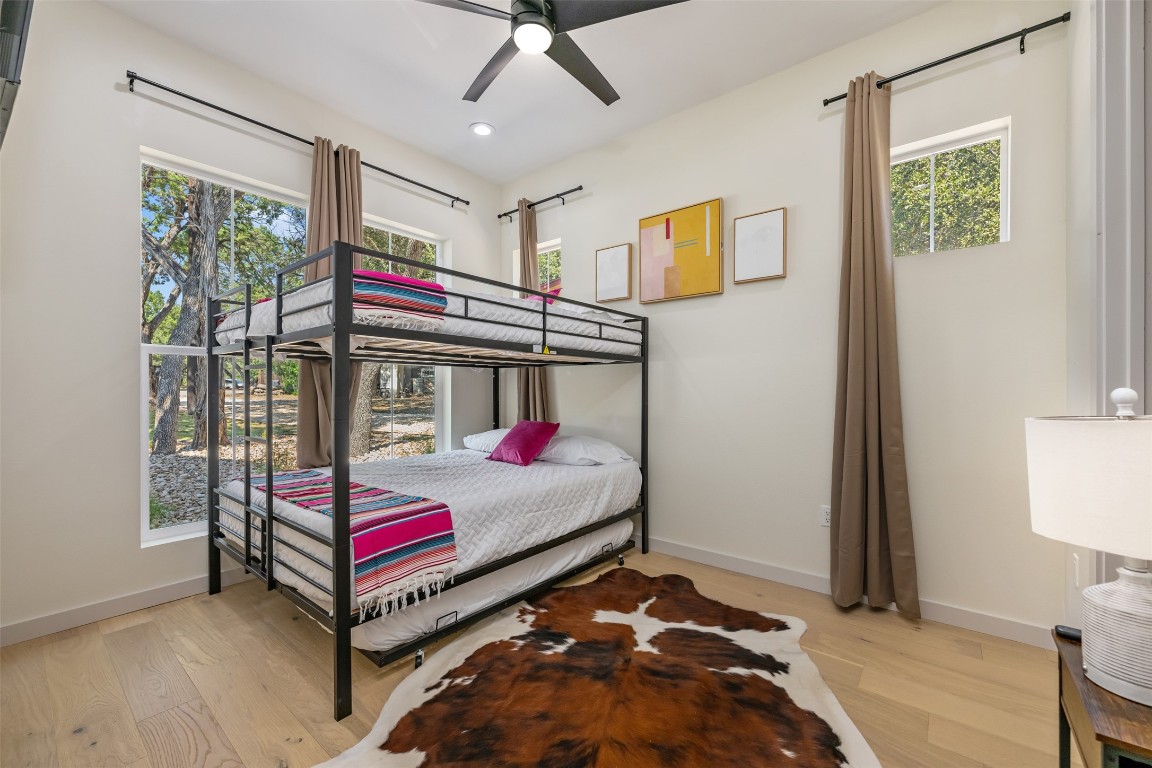 1301 Scenic Circle Spicewood, TX 78669 - Photo 34 of 39 a bedroom with a bed and a window