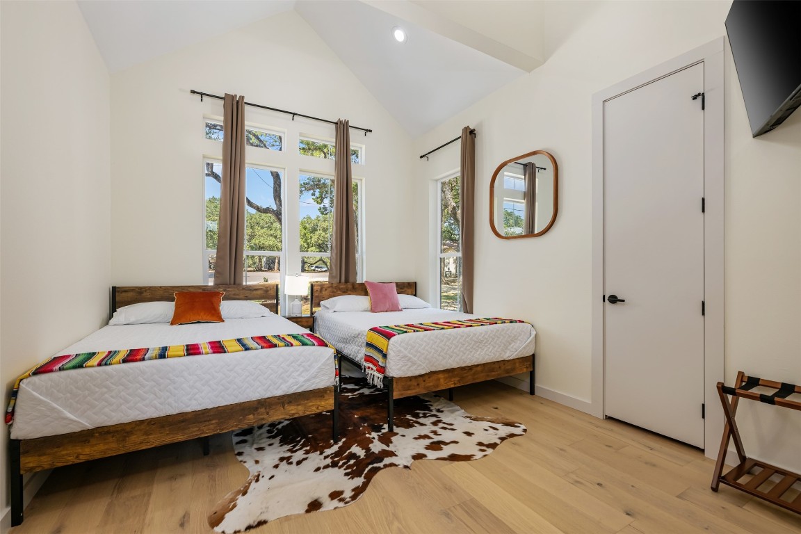 1301 Scenic Circle Spicewood, TX 78669 - Photo 35 of 39 a bedroom with a bed and a window