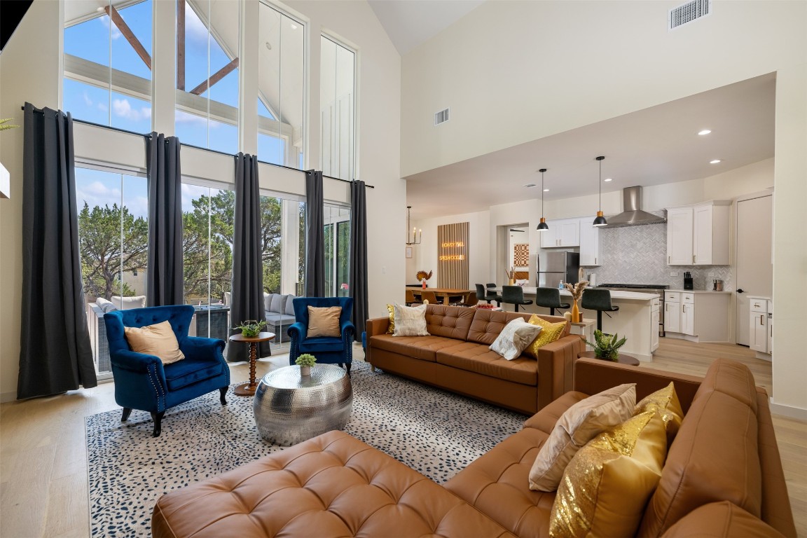 1301 Scenic Circle Spicewood, TX 78669 - Photo 6 of 39 a living room with furniture and a large window
