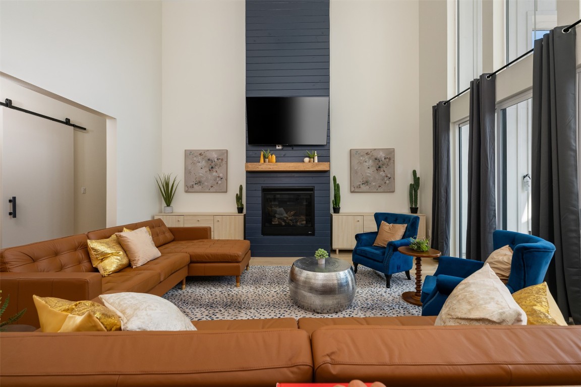 1301 Scenic Circle Spicewood, TX 78669 - Photo 7 of 39 a living room with furniture fireplace and flat screen tv