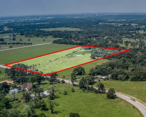 an aerial view of a golf course with a yard