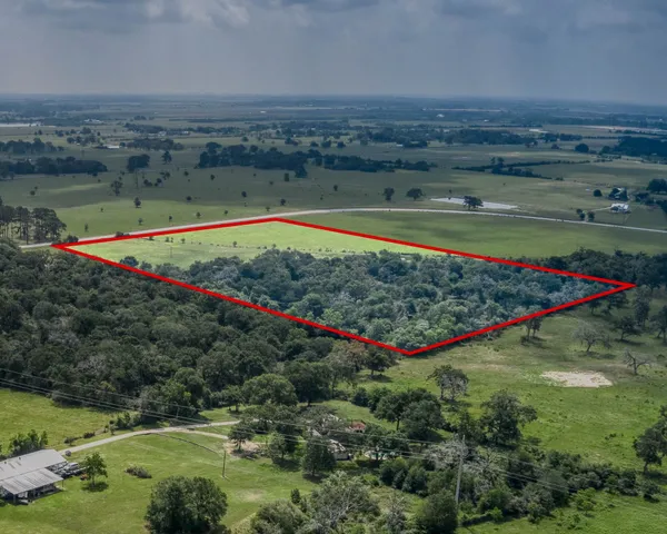 a view of a swimming pool and a yard