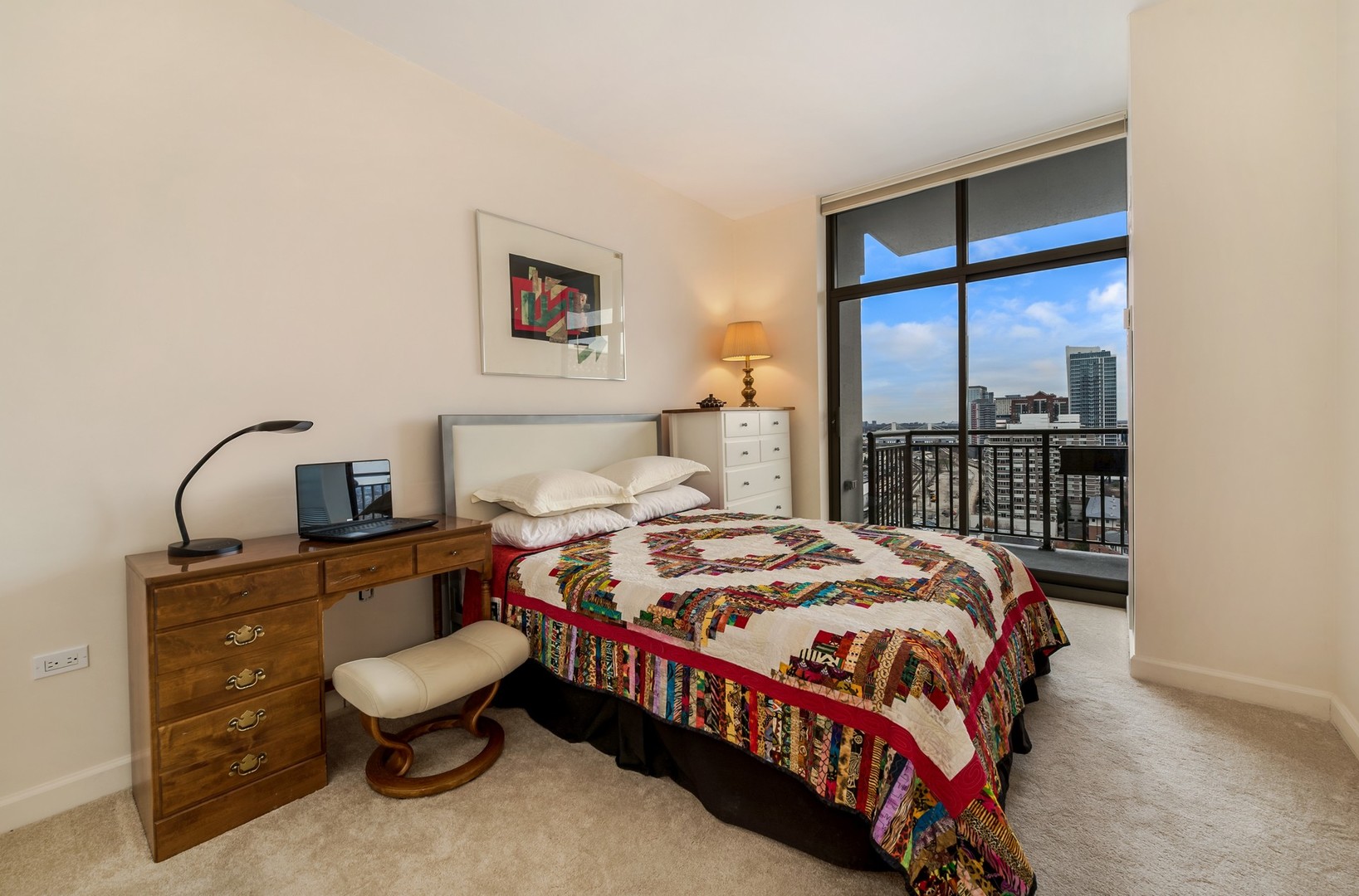 1335 South Prairie Avenue, Unit 1706 Chicago, IL 60605 - Photo 12 of 16 a bedroom with a bed and window