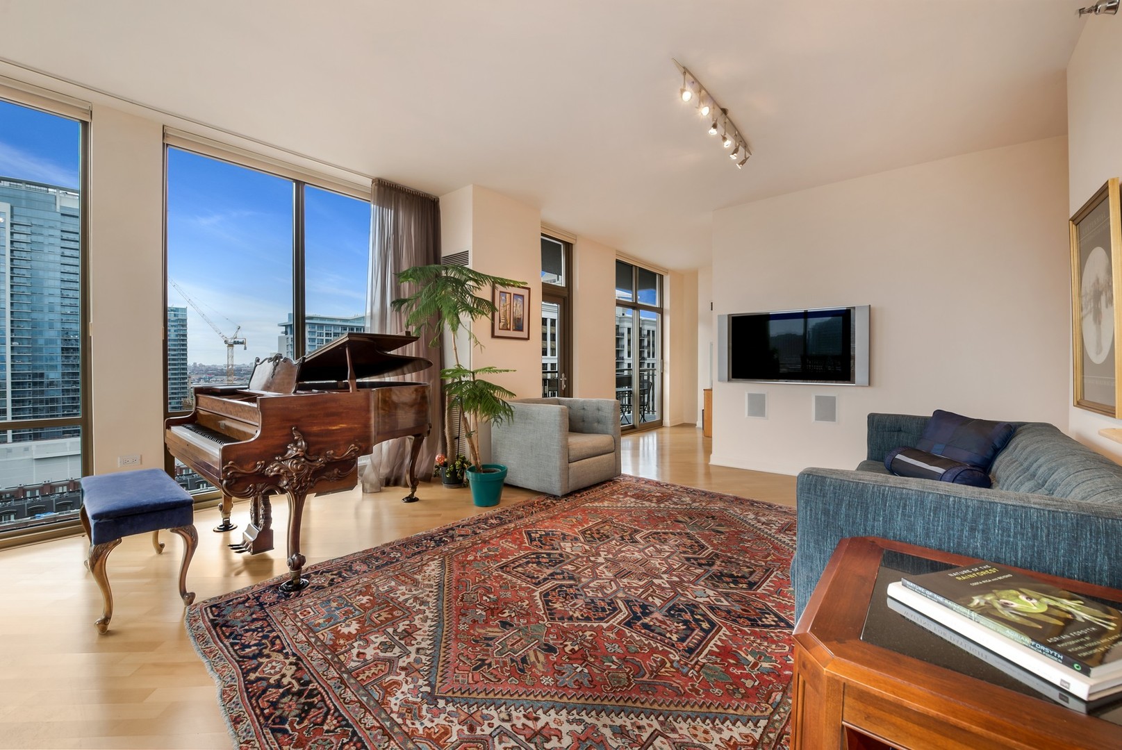 1335 South Prairie Avenue, Unit 1706 Chicago, IL 60605 - Photo 3 of 16 a living room with furniture and a flat screen tv