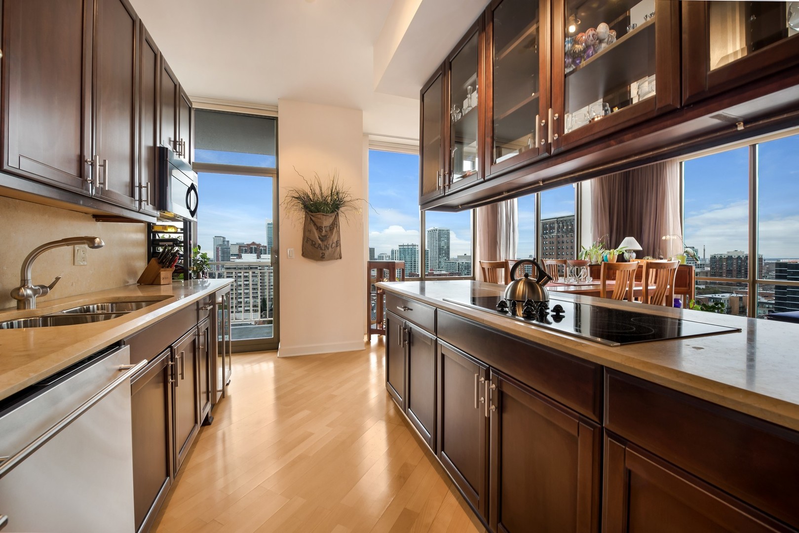 1335 South Prairie Avenue, Unit 1706 Chicago, IL 60605 - Photo 6 of 16 a kitchen with stainless steel appliances sink a stove and cabinets