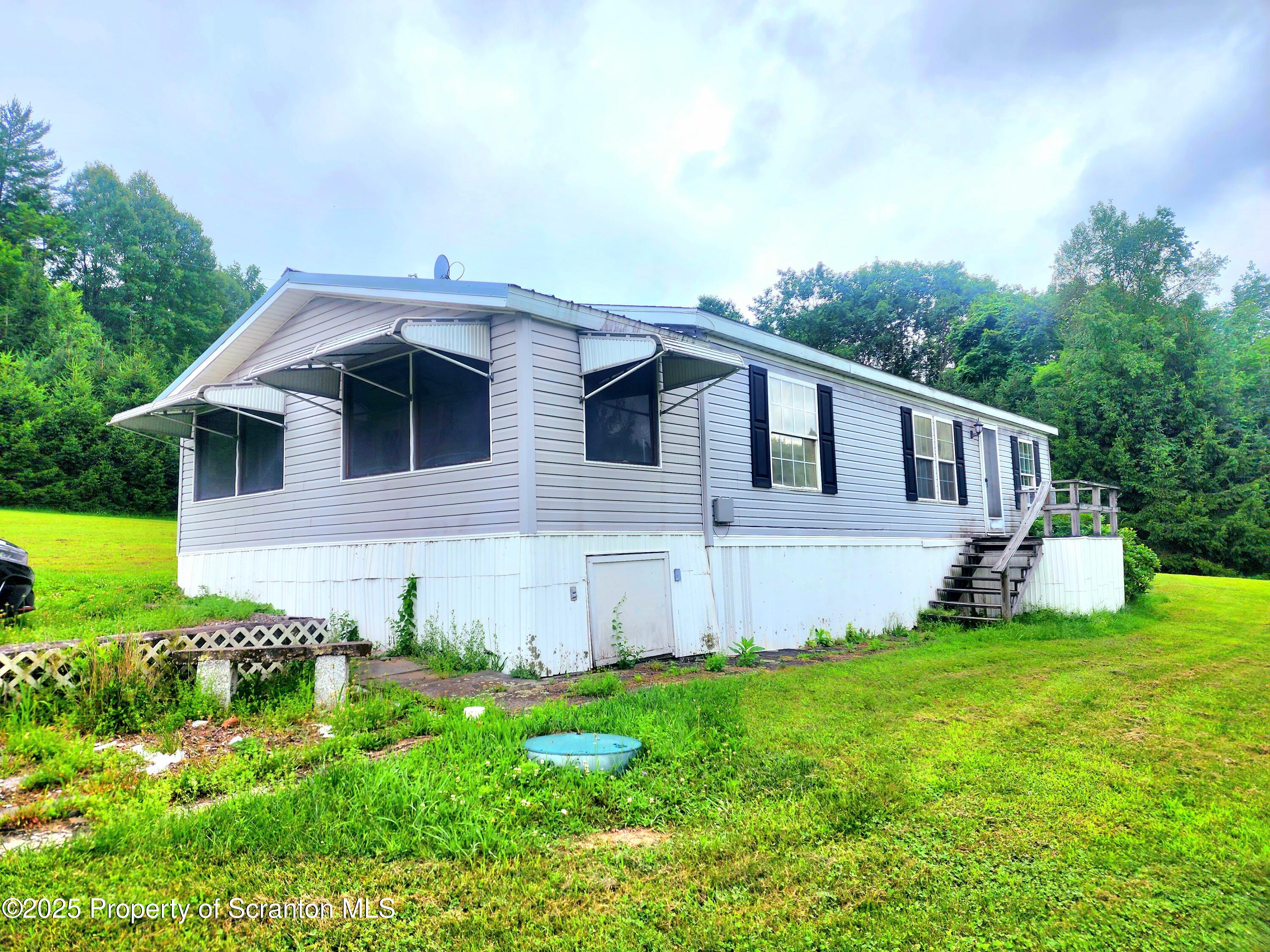 18132 Dimock To Nicholson Road Nicholson, PA 18446 - Photo 15 of 62 front view of a house with a yard