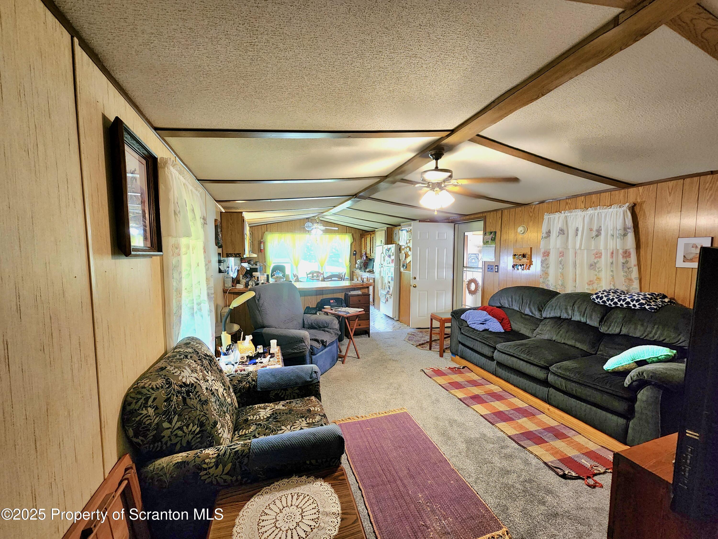18132 Dimock To Nicholson Road Nicholson, PA 18446 - Photo 43 of 62 a living room with furniture and a large window