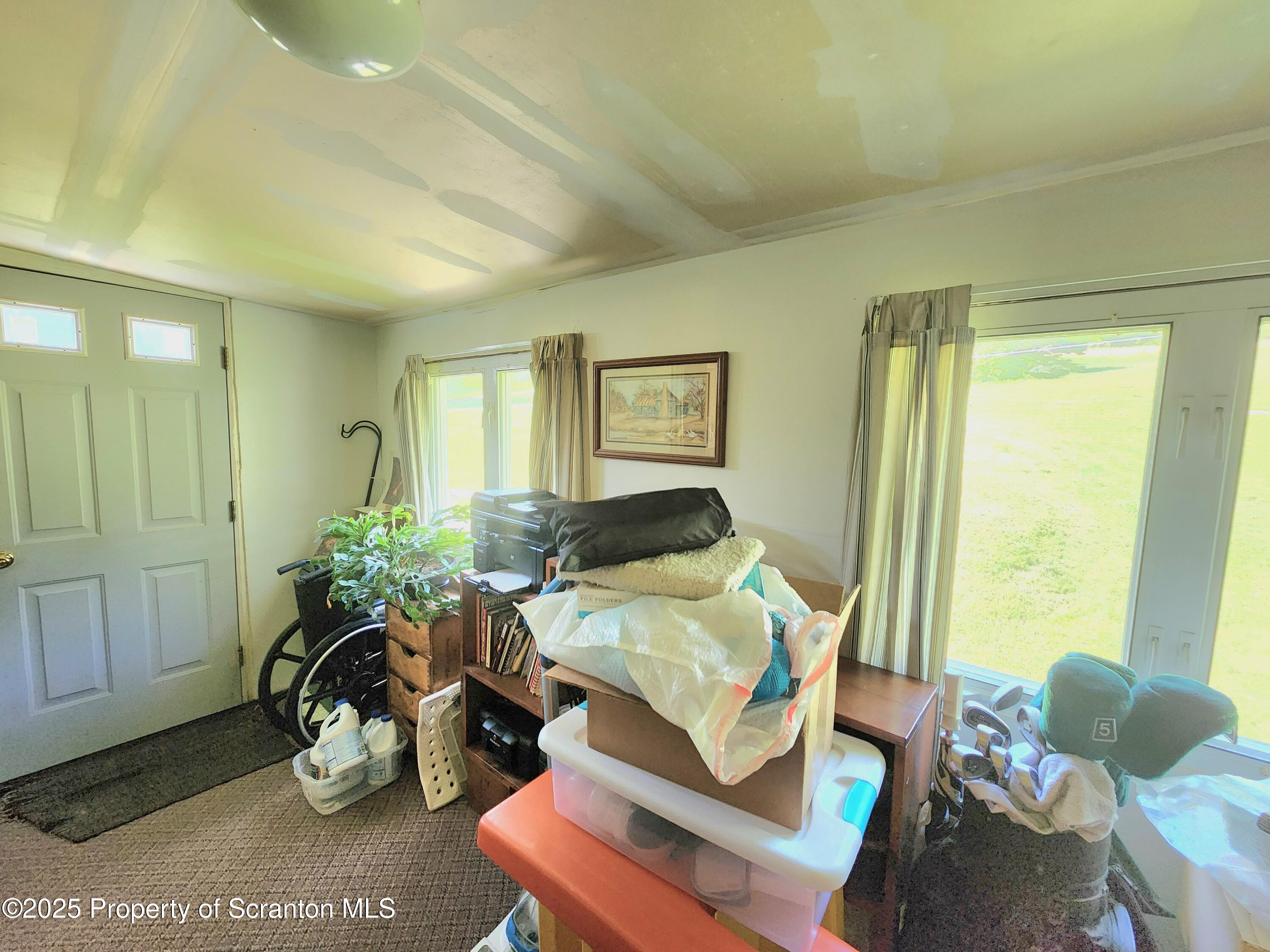 18132 Dimock To Nicholson Road Nicholson, PA 18446 - Photo 46 of 62 a living room with furniture flowerpot and wooden floor