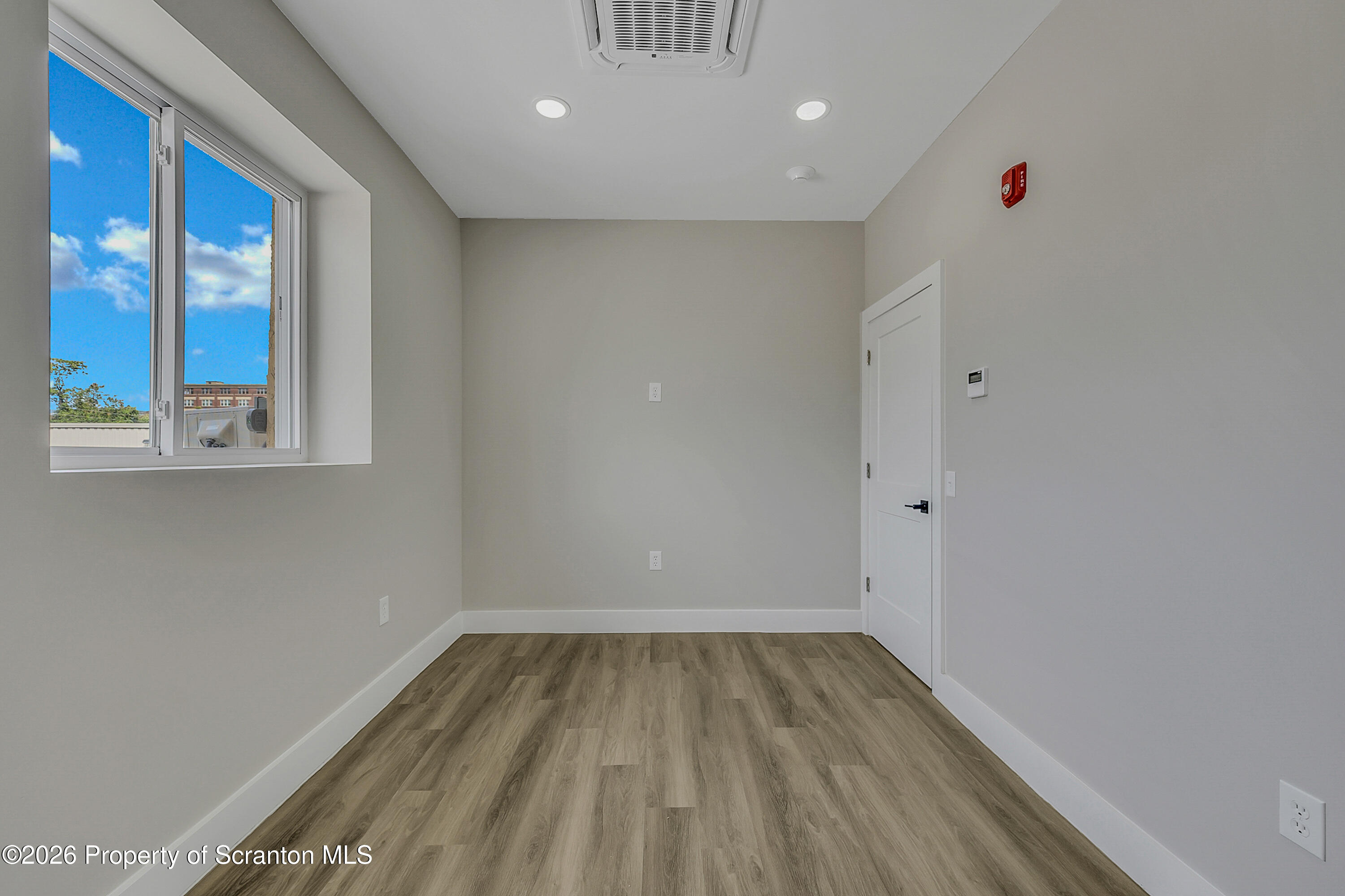 215 Hickory Street, Unit 13 Scranton, PA 18505 - Photo 8 of 13 a view of a room with wooden floor and windows