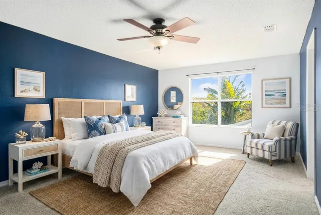 a bedroom with a bed and a couch