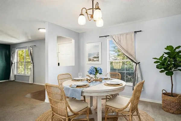 a view of a dining room with furniture window and outside view