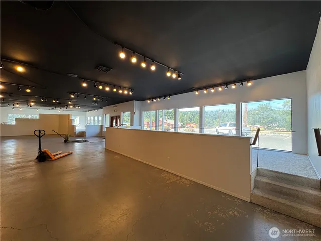 a view of kitchen and hall with a window