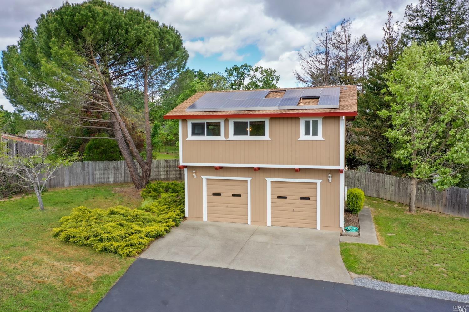 1454 Olivet Road Santa Rosa, CA 95401 - Photo 24 of 30 a front view of a house with a garden and plants