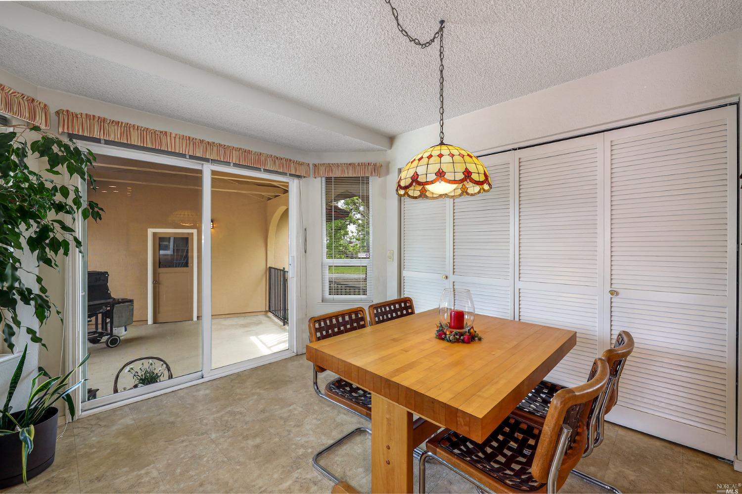 1454 Olivet Road Santa Rosa, CA 95401 - Photo 8 of 30 a dining room with a table and chairs