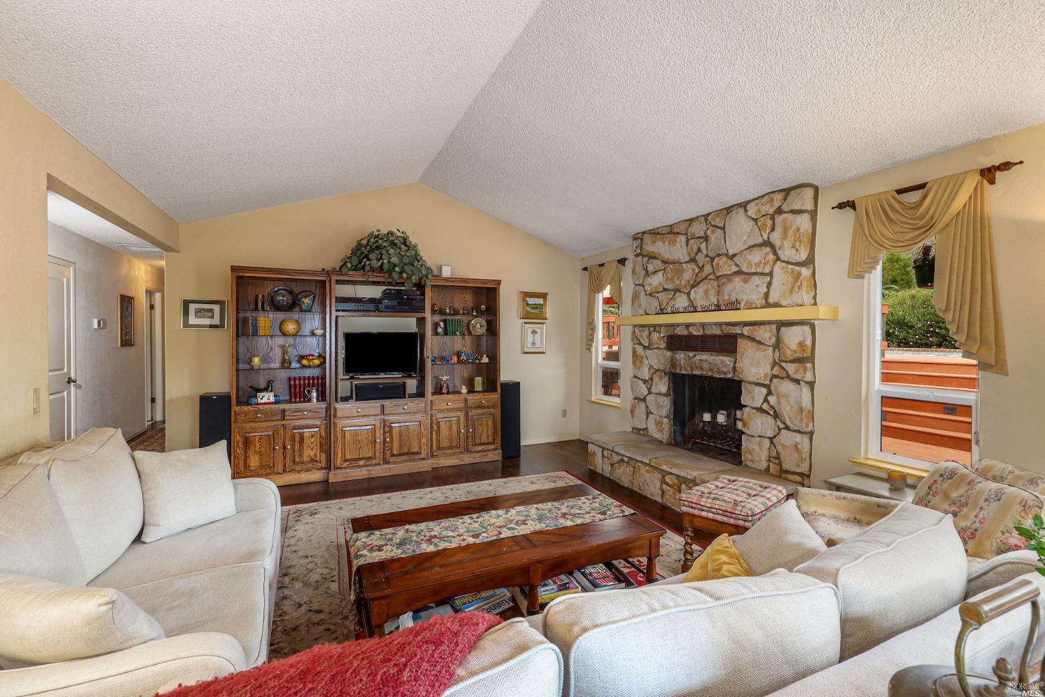 1454 Olivet Road Santa Rosa, CA 95401 - Photo 9 of 30 a living room with furniture and a fireplace