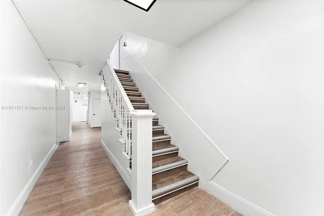 a view of a hallway with stairs