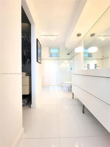 a bathroom with a bathtub and a sink