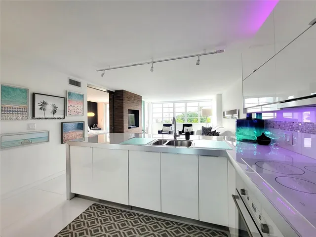 a kitchen with sink cabinets and window