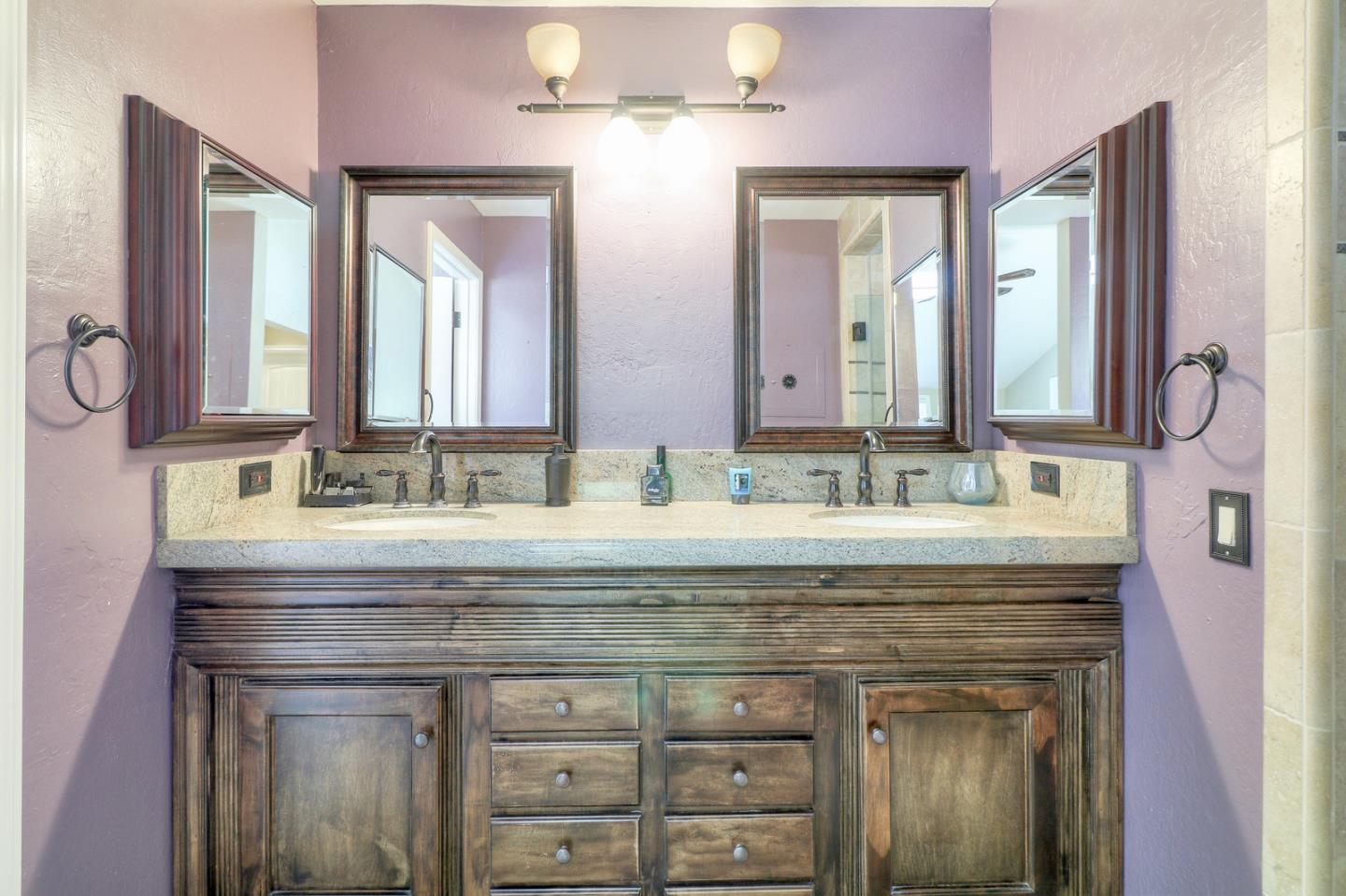 8445 Watsonville Road Gilroy, CA 95020 - Photo 26 of 50 a bathroom with a sink vanity and a mirror