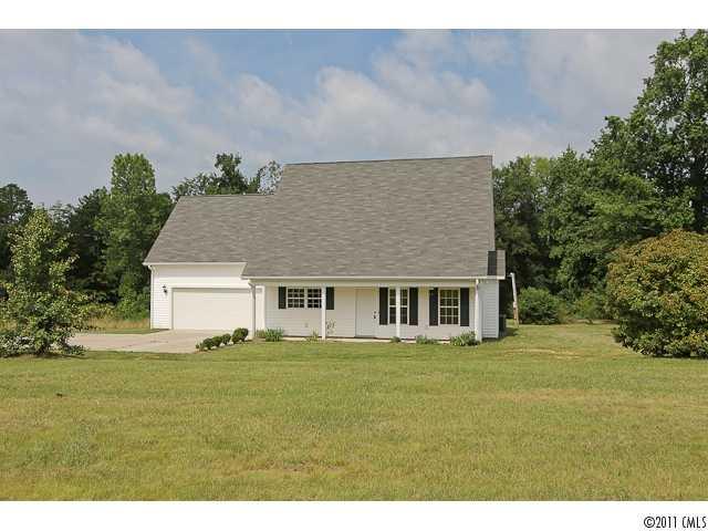1740 Dunlap Roddey Road Rock Hill, SC 29730 - Photo 1 of 16 a front view of house with yard and trees in the background