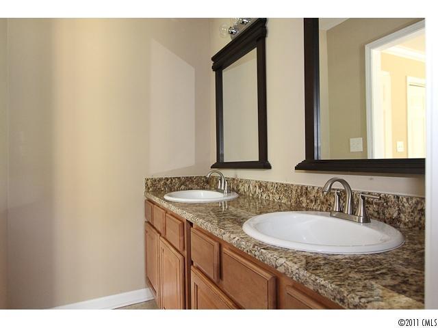 1740 Dunlap Roddey Road Rock Hill, SC 29730 - Photo 12 of 16 a bathroom with a granite countertop sink and a mirror