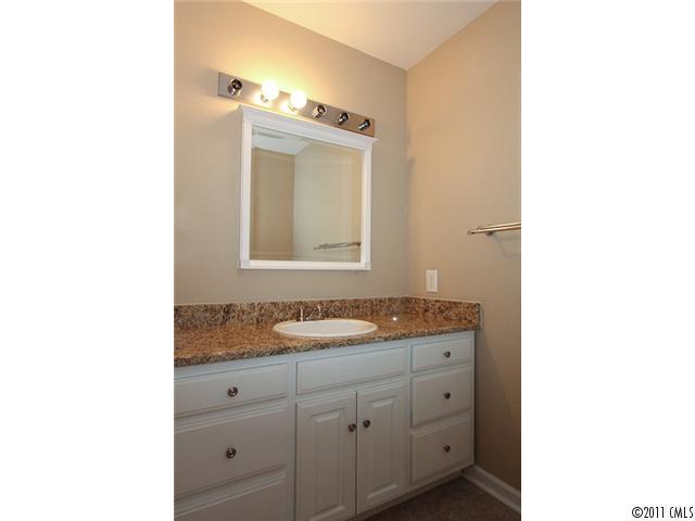 1740 Dunlap Roddey Road Rock Hill, SC 29730 - Photo 16 of 16 a bathroom with a granite countertop sink and a mirror