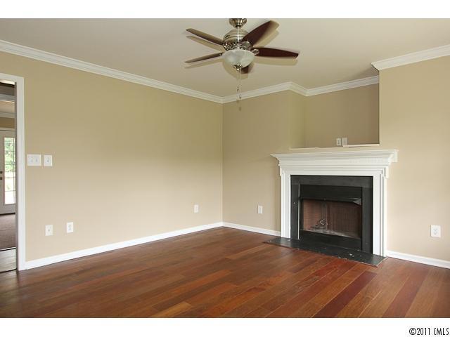 1740 Dunlap Roddey Road Rock Hill, SC 29730 - Photo 5 of 16 a view of an empty room with a fireplace and a window