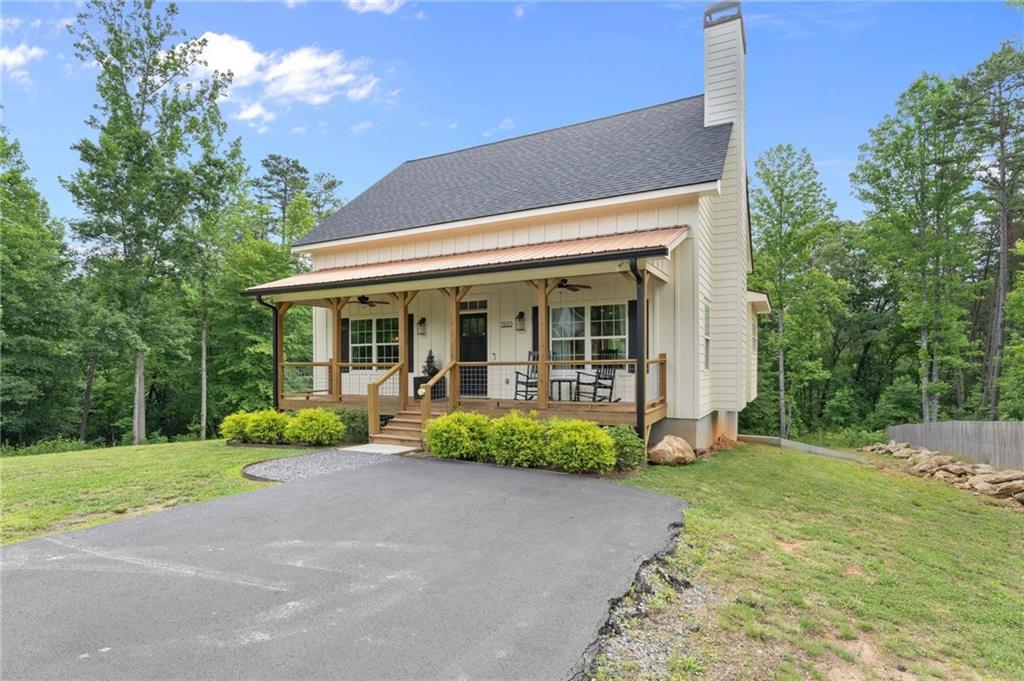 1300 Preacher Campbell Road Clarkesville, GA 30523 - Photo 27 of 34 a front view of a house with garden