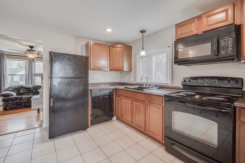 4 Jean Drive Springfield, MA 01104 - Photo 14 of 26 a kitchen with stainless steel appliances granite countertop a refrigerator stove and sink