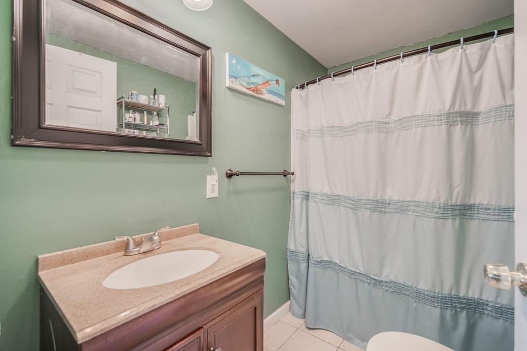 4 Jean Drive Springfield, MA 01104 - Photo 19 of 26 a bathroom with a sink mirror and toilet